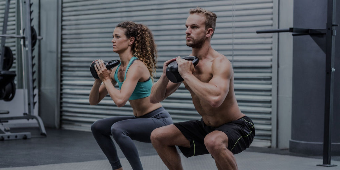 Two people exercising with dumbbells in a gym setting